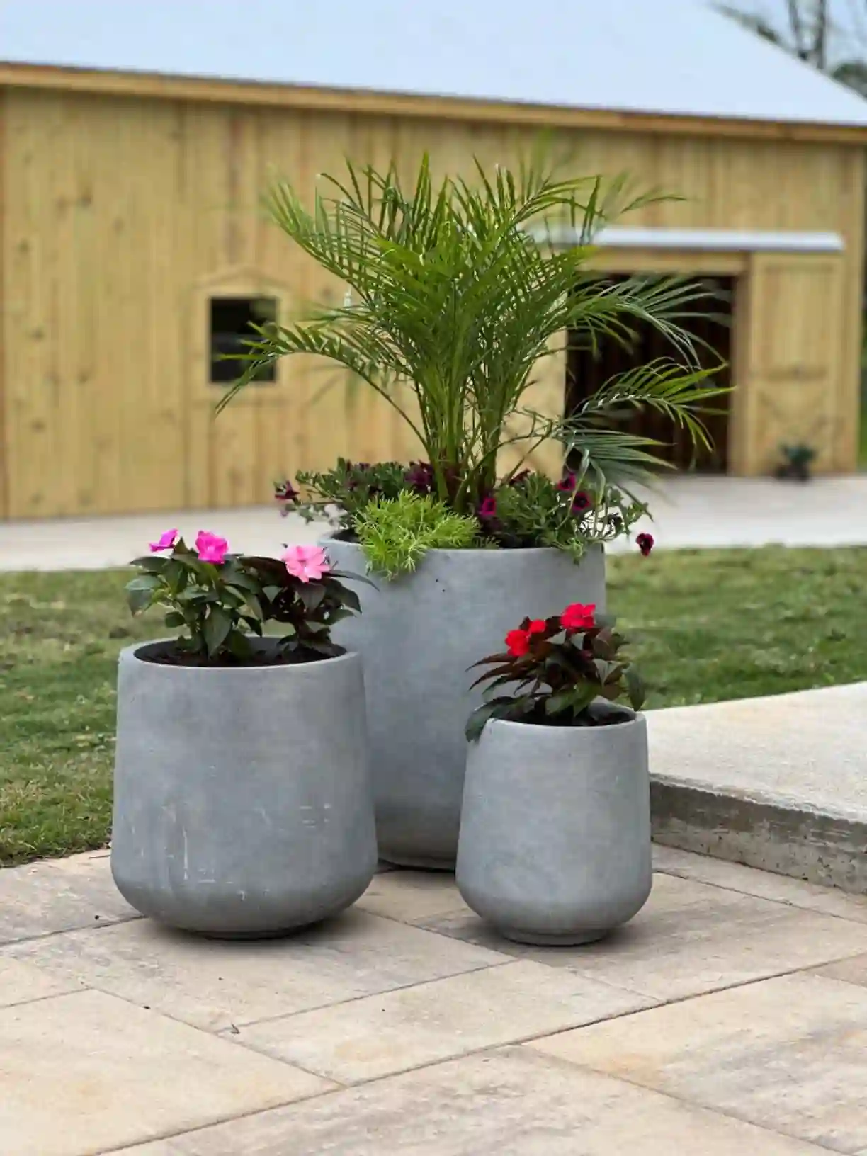 Modern interior decor featuring a set of grey indoor concrete planters